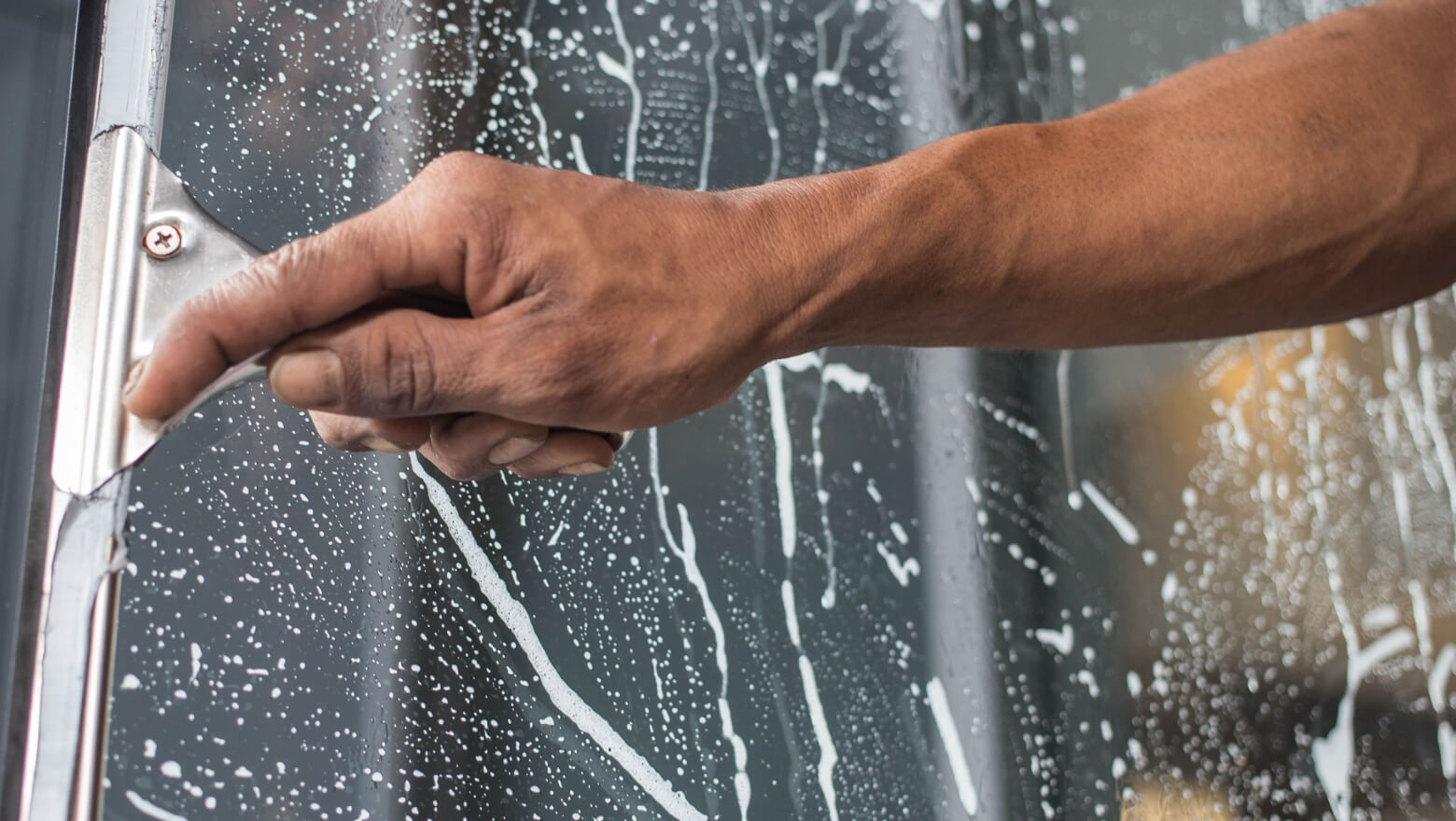 Cleaning glass surfaces